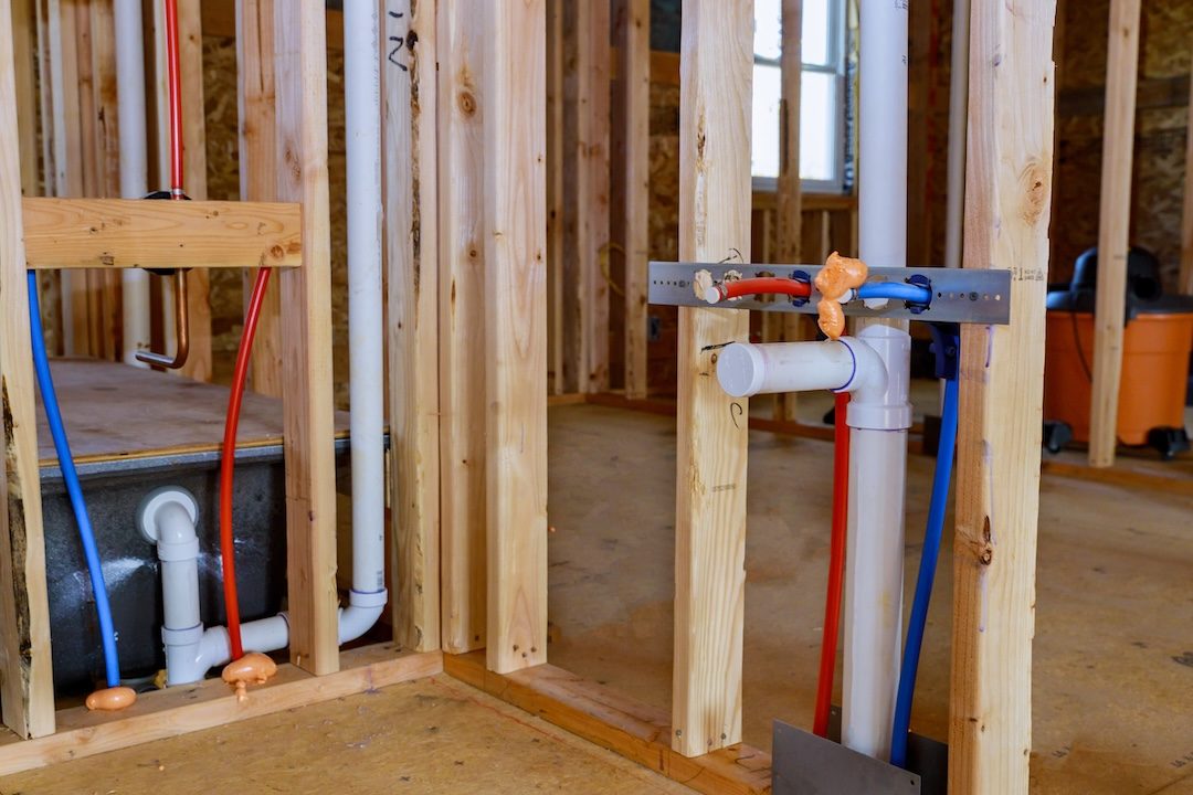 Rough-in plumbing pipes in wall during fixture relocation — Scarborough Plumbing renovation