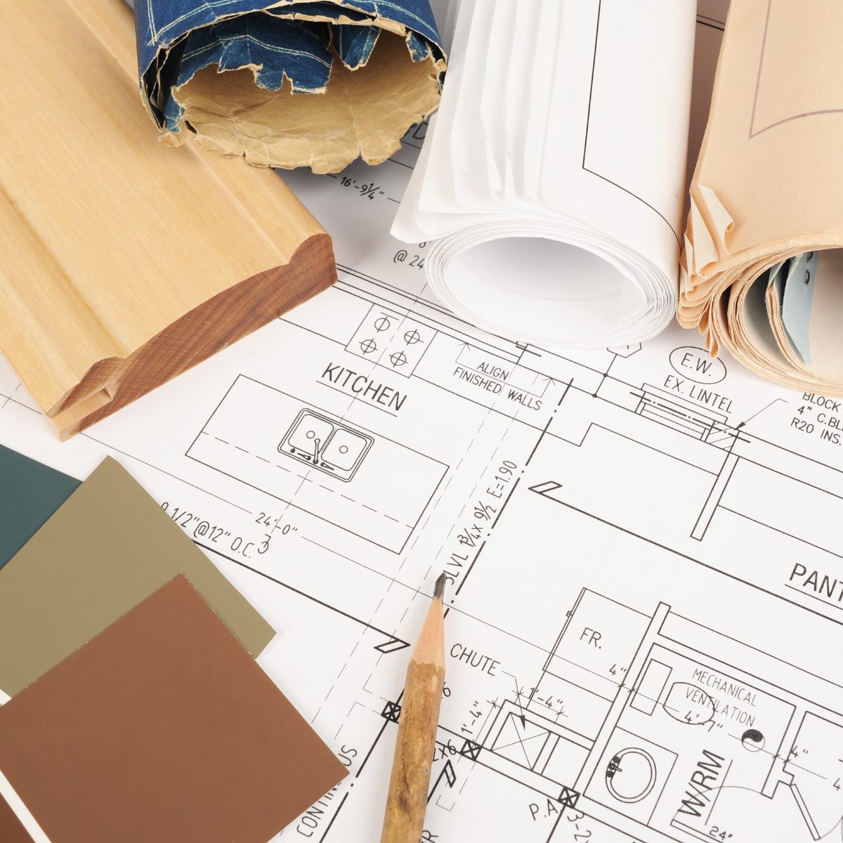Renovation planning blueprints with timber samples and colour swatches — plumbing planning for a home renovation